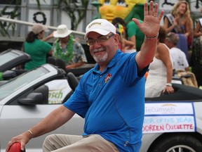 Tecumseh Mayor Gary McNamara waves to the crowd along McNorton Street during Tecumseh Corn Festival parade Saturday August 23, 2014. (NICK BRANCACCIO/The Windsor Star)
