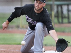 Tecumseh Thunder first baseman Mitch Delaney scoops up a throw against the Windsor Stars at Lacasse Park. (DAN JANISSE/The Windsor Star)