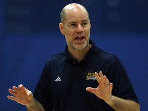 Windsor Lancers head coach Chris Oliver conducts practice at the St. Denis Centre. Oliver will take a one-year sabbatical from his job as men's basketball coach to work with pro teams and teach at clinics around the world.