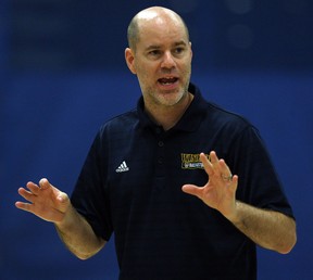 Windsor Lancers head coach Chris Oliver conducts practice at the St. Denis Centre. Oliver will take a one-year sabbatical from his job as men's basketball coach to work with pro teams and teach at clinics around the world.