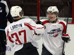 Windsor Spitfires goalscorer Logan Brown, left, is congratulated by Team White teammate Luke Kirwin during annual Blue vs. White Game at WFCU Centre August 28, 2014.  (NICK BRANCACCIO/The Windsor Star)
