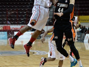 Windsor's Stefan Bonneau, left, is guarded by Ottawa's Ryan Anderson at the WFCU Centre. (DAN JANISSE/The Windsor Star)