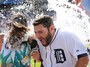 Alex Avila of the Detroit Tigers celebrates as his teammates dump the water bucket over his head after hitting the game-winning single to left field in the bottom of the ninth inning against the New York Yankees at Comerica Parl. (Photo by Leon Halip/Getty Images)
