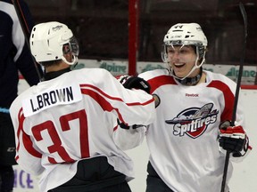 Windsor Spitfires goalscorer Logan Brown, left, is congratulated by Team White teammate Luke Kirwin during the annual Blue vs. White Game at the WFCU Centre. (NICK BRANCACCIO/The Windsor Star)