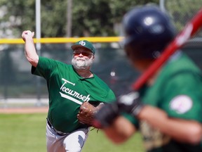 Tecumseh pitcher Cliff Bechard delivers the ball Saturday, August 16, 2014, against Oakville in the 50-plus provincial championship in teh Vintage Baseball Federation of Ontario.  (JASON KRYK/The Windsor Star)