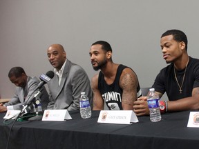 Windsor Express president and CEO Dartis Willis, from left, and coach Bill Jones announce four new players to their team at the Downtown Windsor Business Accelerator. The new players are R.J. Wells, Gary Gibson and Karl Finley. (DYLAN KRISTY/The Windsor Star)