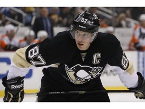 Pittsburgh Penguins superstar Sidney Crosby was among those taking part in the ice bucket challence for ALS awareness.
Photograph by: AP Photo/Gene J. Puskar, File , Postmedia News