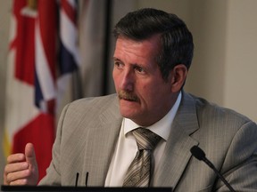 Councillor John Sutton speaks during discussion of the financial review findings given by Deloitte at Town Council,  Monday, August 11, 2014.   (DAX MELMER/The Windsor Star)