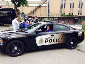 Ruthven's Meghan Agosta-Marciano poses in a Vancouver police cruiser to announce her new job on the police force. (Twitter/The Windsor Star)