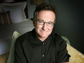 This June 15, 2007 file photo shows actor and comedian Robin Williams posing for a photo in Santa Monica, Calif. Williams, whose free-form comedy and adept impressions dazzled audiences for decades, died Monday, Aug. 11, 2014, in an apparent suicide. Williams was 63.  (AP Photo/Reed Saxon, File)