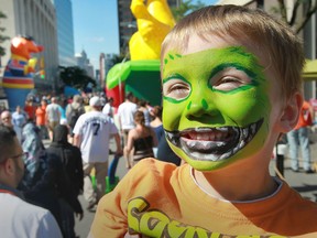 Greyson Comeau, age 5, from Windsor is all smiles during Balloonapalooza in downtown Windsor, Ontario on August 17, 2014.   The family event was a huge success as 80 cold air balloons and other inflatables were displayed in downtown Windsor over the weekend.  (JASON KRYK/The Windsor Star)