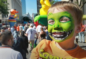 Greyson Comeau, age 5, from Windsor is all smiles during Balloonapalooza in downtown Windsor, Ontario on August 17, 2014.   The family event was a huge success as 80 cold air balloons and other inflatables were displayed in downtown Windsor over the weekend.  (JASON KRYK/The Windsor Star)