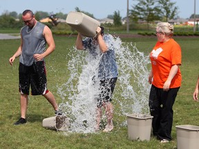 Staff and residents of the Village of Aspen Lake take the ice bucket challenge in front of the residence in Windsor on Monday, August 25, 2014. The group hoped to raise 500 dollars for ALS.              (Tyler Brownbridge/The Windsor Star)