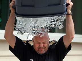 Sgt. Matt D'Asti takes the ALS Ice Bucket Challenge in front of Windsor Police Headquarters in Windsor on Monday, August 18, 2014. (Tyler Brownbridge/The Windsor Star)