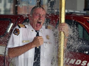 Windsor Fire Chief Bruce Montone takes the ALS Ice Bucket Challenge at station 1 in Windsor on Thursday, August 21, 2014. (Tyler Brownbridge/The Windsor Star)