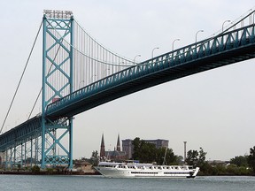 The Grande Carib cruise ship sails under the Ambassador Bridge as it makes it's way along the Detroit River in Windsor on Tuesday, August 19, 2014.               (Tyler Brownbridge/The Windsor Star)