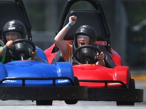 From left, John Anthony and Michael Gonzalez, both grade six students at St. Gregory's Elementary school, race each other in the go-karts at XS Famiy Fun Centre in this 2011 file photo.  (DAX MELMER / The Windsor Star)