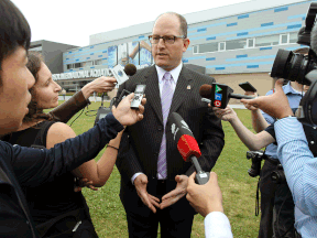 Ward 1 Coun. Drew Dilkens answers questions from the media after announcing his candidacy for Windsor mayor on Aug. 5, 2014. (Tyler Brownbridge / The Windsor Star)