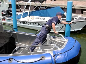 Windsor Police Marine Unit Cst. T.J. Rocheleau can be seen aboard the Defender patrol, Friday, Aug. 1, 2014 leaving Lakeview Park Marina. (RICK DAWES/The Windsor Star)