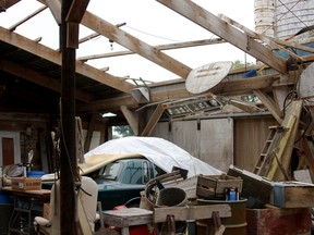 The contents of a barn are pictured after parts of its roof were blown off and metal door lifted Thursday, Aug. 21, in Harrow. Environment Canada workers came down from Toronto to try and determine if the area was struck by a tornado earlier this week. (RICK DAWES/The Windsor Star)