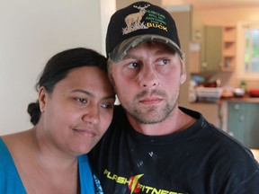 Cindy Hendricks and Chris Schmidt lost all their belongings following a fire at their rental unit.  The Cavalry Baptist Church has reached out to help the young  couple and their two children. (JASON KRYK/The Windsor Star)