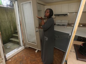 Stella Sodade said a rush of water forced its way into her basement Monday and broke the door of her Southwood Lakes home in Windsor on Tuesday, JAugust 12, 2014.  (DAN JANISSE/The Windsor Star)