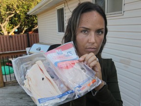 Jennifer Murray a package of Maple Leaf lunch meat that she claims contained a fly and fly eggs. (JASON KRYK/ The Windsor Star