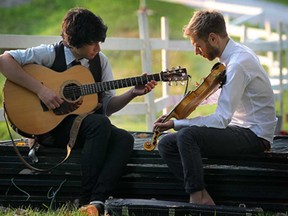 Performers Quinn Bachand, left, and Jaron Freemon-Fox warm up back stage at the inaugural Kingsville Folk Music Festival on Friday, August 8, 2014. The event runs all weekend at the Lakeside Park.  (DAN JANISSE/The Windsor Star)