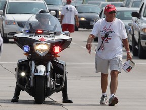 Grandpa Bob's 4,000-kilometre Walk for Louie arrived in Windsor, ON. on Friday, August 1, 2014. Grandpa Bob's brother Gino Facca, right, walks along Tecumseh Road East during the walk which raises money for Duchenne's Muscular Dystrophy research.  (DAN JANISSE/The Windsor Star)