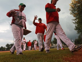 Leamington Greenhouse baseball players leave the field after the Essex County Senior Baseball League game in Leamington, Ontario on July 30, 2014.  The Leamington Greenhouse team is comprised entirely of Mexican migrant farm workers.  (JASON KRYK/The Windsor Star)