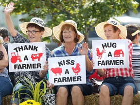 Thanking, kissing, and hugging farmers is encouraged during the parade at the 160th Harrow Fair in downtown Harrow, Saturday, August 30, 2014.  (DAX MELMER/The Windsor Star)