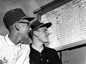Dan Hasson, left, and Bill Ruiter look at their scores during the 1964 Essex-Kent Boys Golf Tournament. (Windsor Star files)