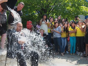 Onorio Colucci, treasurer for the City of Windsor participates in the ALS Ice Bucket Challenge at City Hall Square on August 22, 2014. (JASON KRYK/The Windsor Star)