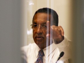 Mayor of Amherstburg Wayne Hurst is seen through the council chamber doors at the Amherstburg Municipal Building Thursday, Aug. 28, 2014. Council held an in-camera session. (RICK DAWES/The Windsor Star)