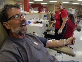 Jean Barrette donates blood for the 200th time at Canadian Blood Services on Grand Marais Road East Thursday August 21, 2014. (NICK BRANCACCIO/The Windsor Star)