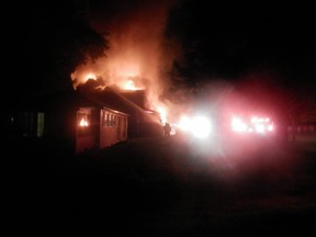 Leamington fire crews battle a blaze at a house in the 100 block of Lakeshore Road in Leamington, Ont. Tuesday, Aug. 5, 2014. (DEBBIE LAUZON/Special To The Star)