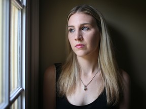 Brandi Dugal, 22, pictured at her father's home, Monday, August 4, 2014, was diagnosed with Lyme disease nearly a month ago.  However, she has been living with symptoms of the disease for over two years.  (DAX MELMER/The Windsor Star)