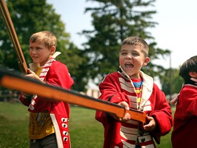 Fadi Kareem, 5, centre, joins more than a dozen other children for the mini militia lesson at Fort Malden's Military Heritage Days, Sunday, August 3, 2014.  (DAX MELMER/The Windsor)