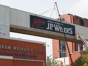 Traffic on Riverside Drive west was detoured for several hours as a new J.P. Wiser's sign was installed at Hiram Walker's and Sons in Windsor.   (JASON KRYK/The Windsor Star)