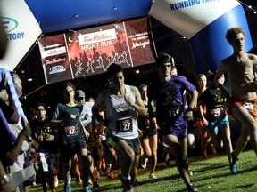 Participants leave the start line Saturday, Aug. 16, at the Tim Horton's night run/walk fundraiser in Dieppe Gardens for Maryvale School. Participants ran or walked five kilometres along the Detroit River. (RICK DAWES/The Windsor Star)