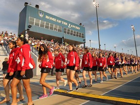 The opening ceremony for the Ontario Summer Games were held Thursday, August 7, 2014, at the Alumni Field at the University of Windsor. Athletes march into the facility during the event.  (DAN JANISSE/The Windsor Star)