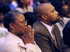 Monica McBride, mother of Renisha McBride cries during the reading of verdict of guilty of of second-degree murder and manslaughter for Theodore Wafer, Thursday, Aug. 7, 2014 in Detroit. Walter Ray Simmons, Renisha's father, is at right. Wafer, 55, shot Renisha McBride through a screen door on Nov. 2, hours after she crashed into a parked car a half-mile from his house. The jury convicted Wafer of second-degree murder and manslaughter after deliberating for about eight hours over two days.  (AP Photo/The Detroit News, Clarence Tabb Jr.)