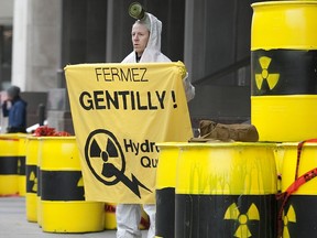 MONTREAL QUE: APRIL 13, 2011 --  In this file photo, Greenpeace activist Guillaume Leroy demonstrates outside Hydro Quebec headquarters in Montreal, Wednesday April 13, 2011.  He was among others from the group who were protesting against Hydro Quebec's Gentilly nuclear plant.  ( Phil Carpenter/ MONTREAL GAZETTE)