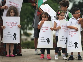 Approximately 300 local people from the  community participated in a demonstration Tuesday, August 5, 2014, in downtown Windsor. Organizers said they wanted people of Windsor to see human face attached to the names of the children that died in the conflict.  (DAN JANISSE/The Windsor Star)