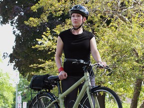 Natalie Bownes on her bike in downtown Windsor on August 26, 2014.  Bownes had her bike stolen from her home last September.  She carries her bike up to her third floor office at the U of W because of theft concerns. (JASON KRYK/The Windsor Star)