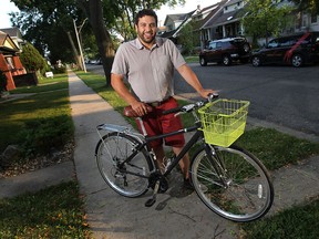 Adriano Ciotoli is shown Wednesday, August 6, 2014, near his Windsor, ON. home with one of his bikes that was stolen then recovered from a pawn shop.   (DAN JANISSE/The Windsor Star) (