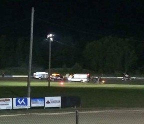 Ambulances on the scene at Canandaigua Motorsports Park on Saturday Aug. 9, 2014 in Canandaigua, N.Y. Authorities are investigating a serious crash that injured one person at a New York dirt track where Tony Stewart was racing on the eve of a NASCAR race. (Logan Messerly/The Associated Press)