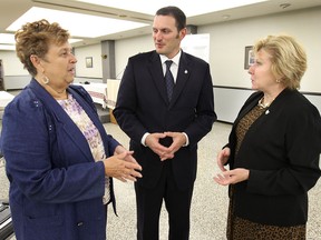 Leisha Nazarewich, left, president of the Ukrainian Canadian Congress-Windsor chapter speaks with MP Jeff Watson and Lois Brown, parliamentary secretary for the Minister of International Development and La Francophonie at the Ukrainian Orthodox Cathedral Of St Vladimir on Tuesday, August 5, 2014, in Windsor, ON. Brown announced $3.6 million funding for the juvenile justice system in the Ukraine.   (DAN JANISSE/The Windsor Star)