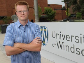 Frazier Fathers, 27, a graduate with a bachelor of arts degree and two masters degrees, is pictured on campus at the University of Windsor, Friday, August 1, 2014.  (DAX MELMER/The Windsor Star)