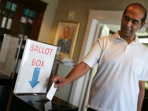 WUFA member Jerry Lalman, professor of civil and environmental engineering, casts his vote on a strike mandate in contract talks with the University of Windsor, Aug. 14, 2014. (Dax Melmer / The Windsor Star)